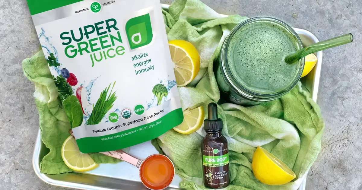 Revitalizing Detox Smoothie Green juice with Super Green Juice, Pure Body and lemons on a tray