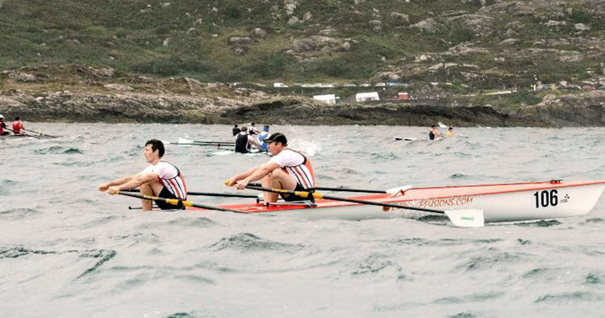 Teacher Becomes Top Athlete group of men rowing